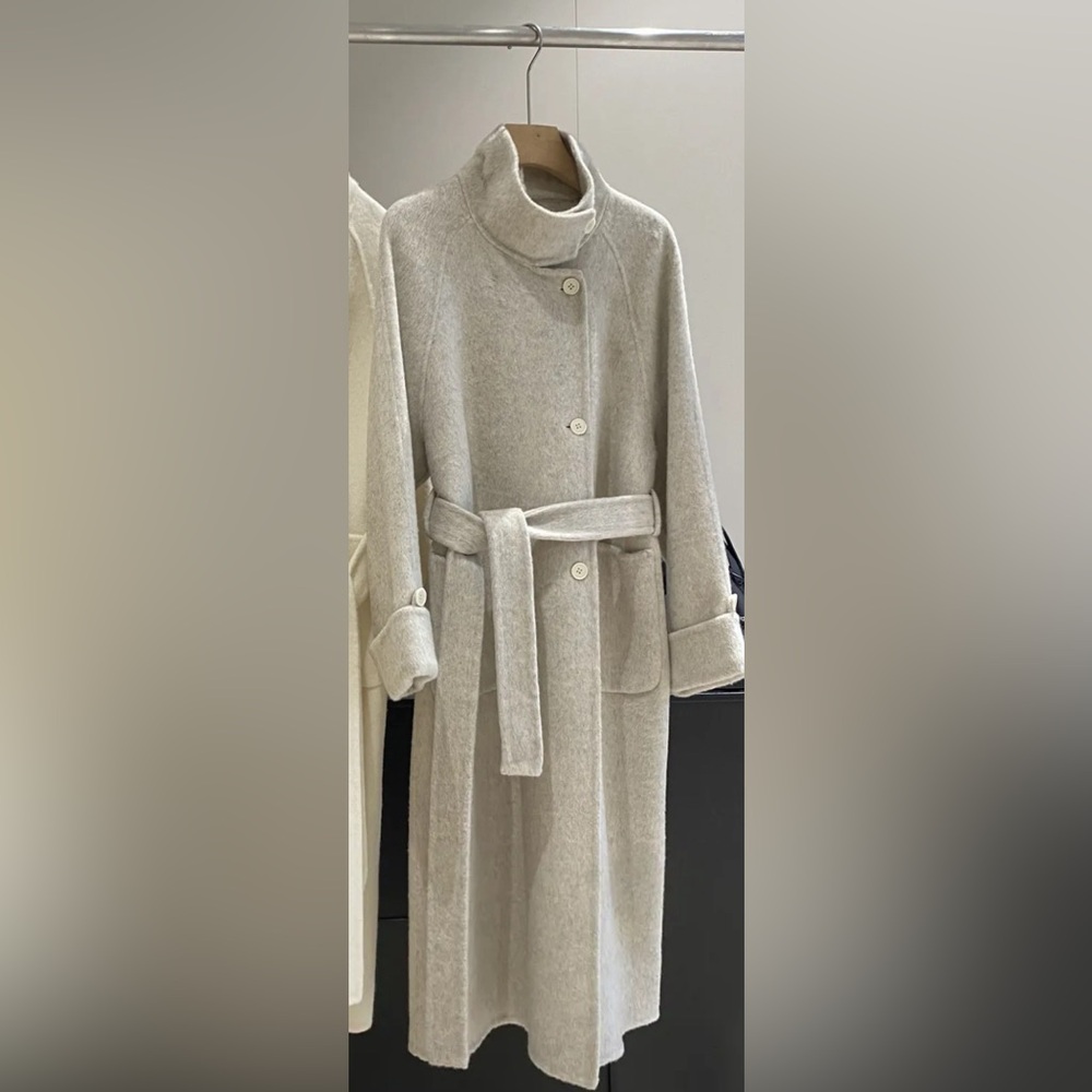 70% wool coat outmeal. Size M but runs big
